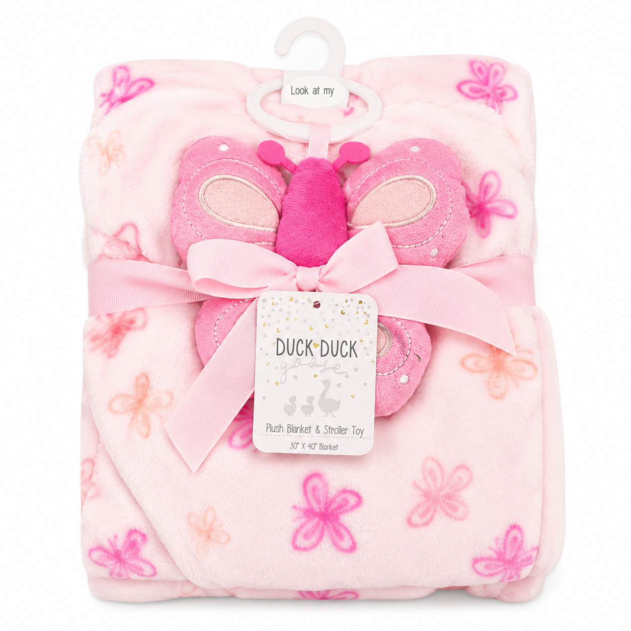 A pink plush baby blanket with a butterfly toy, tied with a pink ribbon and a white hanger tag that reads 'Duck Duck'. The blanket features a soft pink base with darker pink and peach butterfly patterns.
