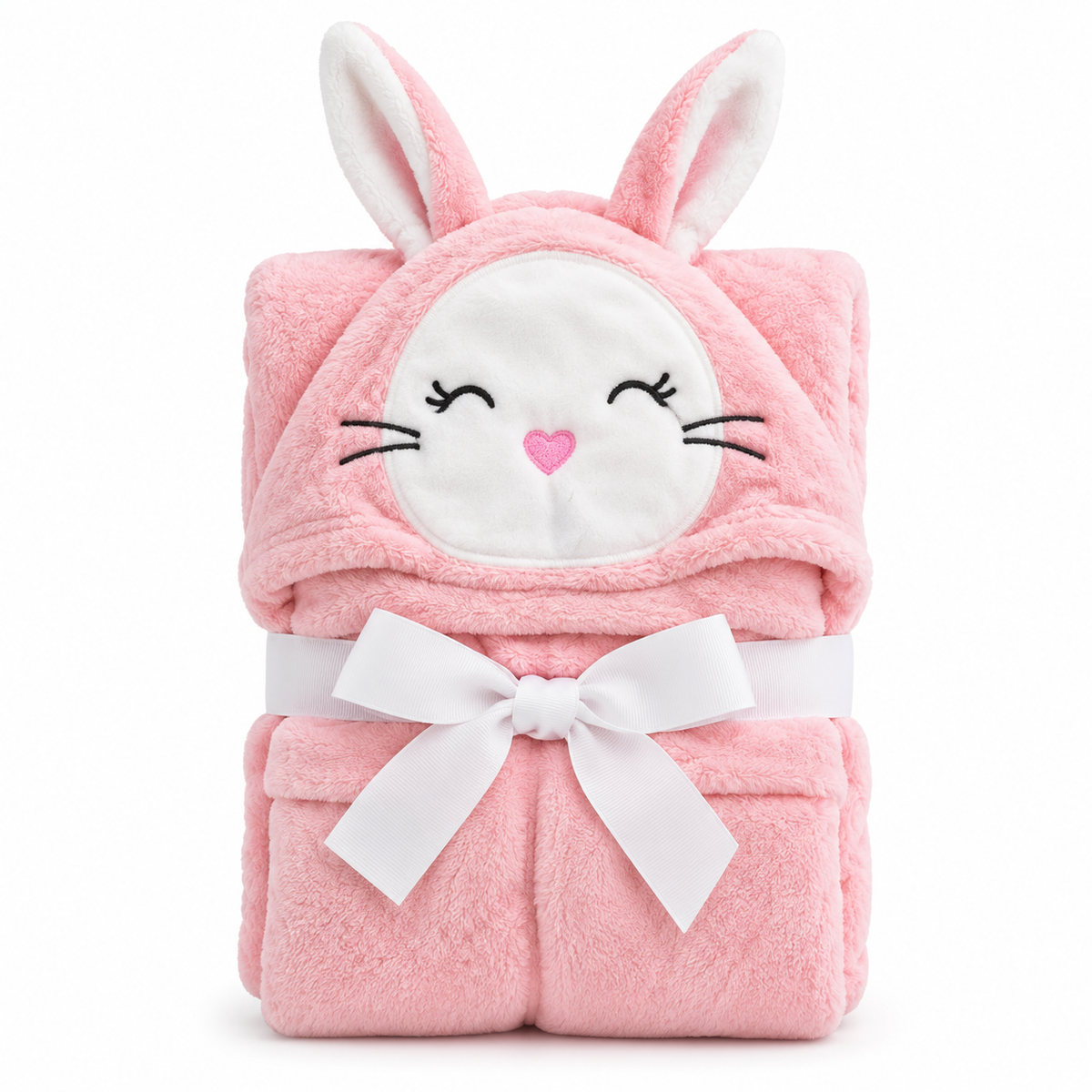 A pink plush bunny hooded blanket or blanket with embroidered bunny face details and a white ribbon bow, photographed on a clean white background.