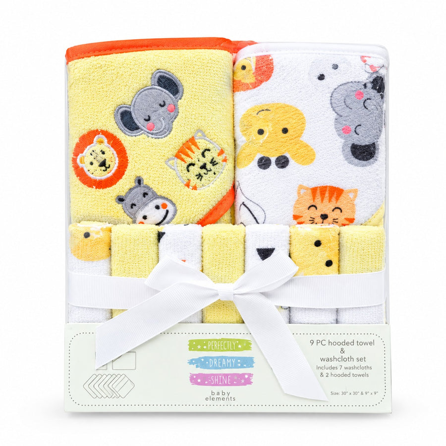 A 9-piece baby bath towel set by ditty dolls, packaged in a clear plastic bag with a white paper insert and tied with a white ribbon. The set includes a yellow hand towel with embroidered animal faces, a white washcloth set with animal prints, and three folded yellow washcloths.