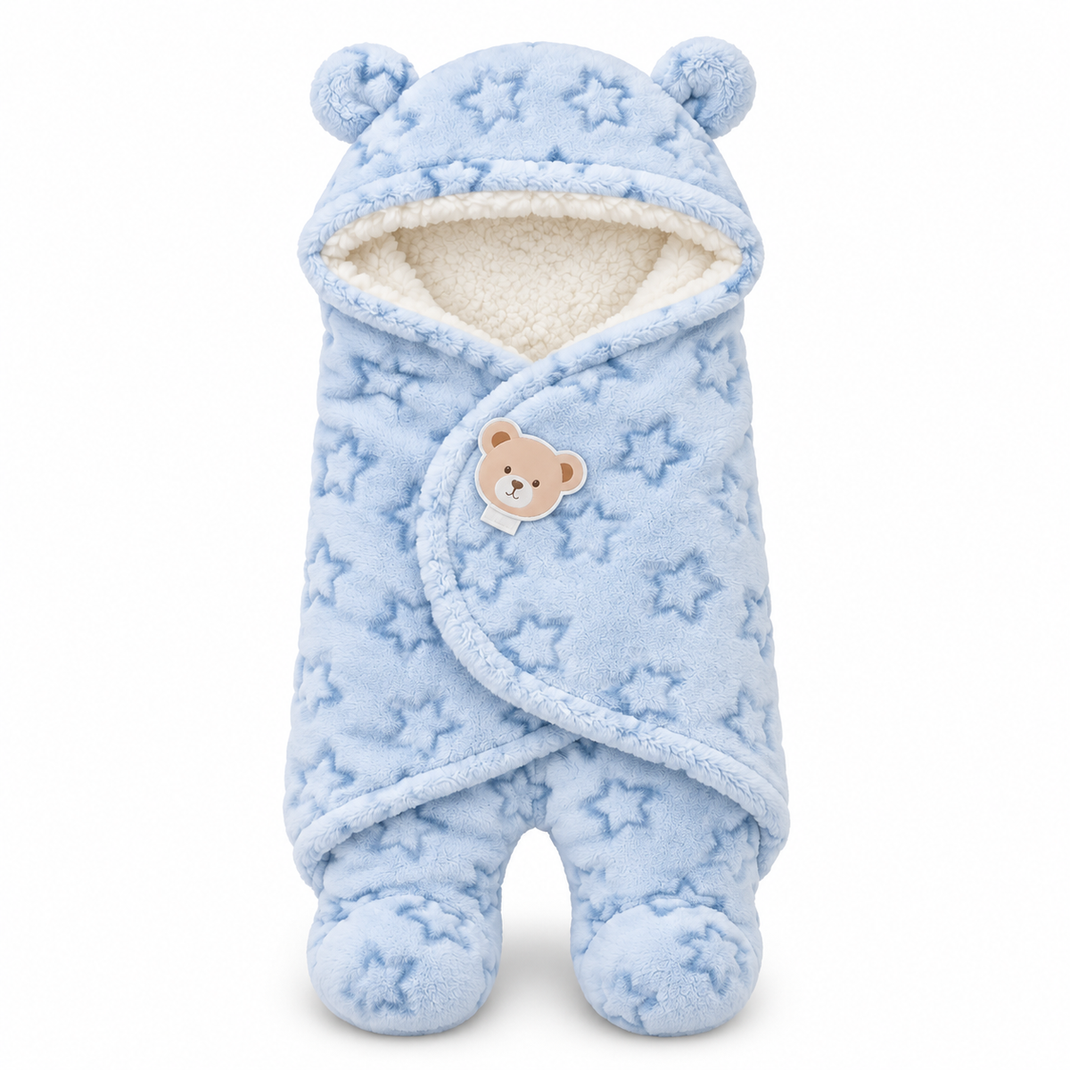 A light blue plush baby wrap blanket with an all-over star pattern, featuring a hood with bear ears, a cream sherpa lining, and a small teddy bear patch on the front.