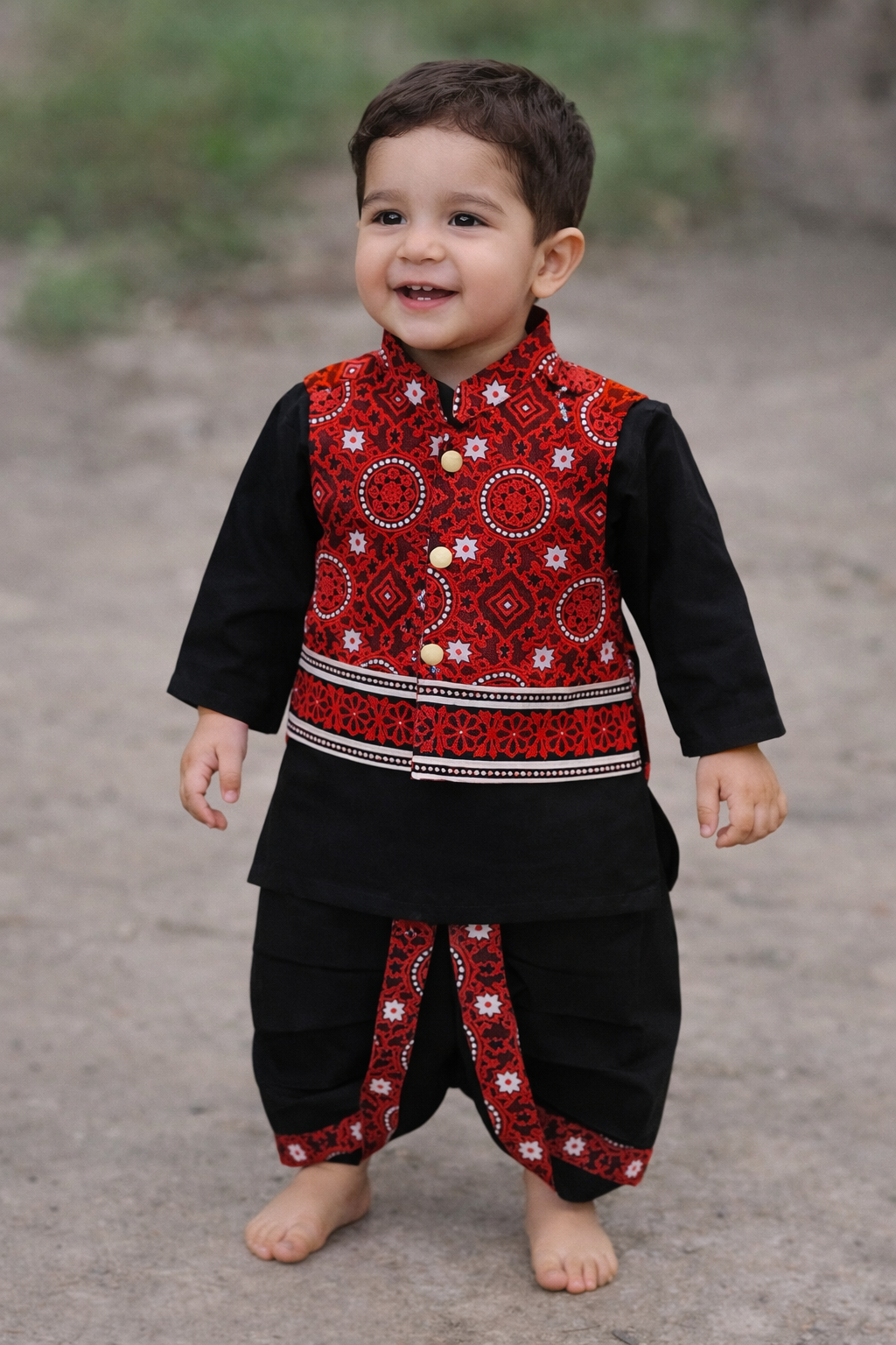 Boy wearing premium baby dhoti kurta with Sindhi Ajrak waistcoat