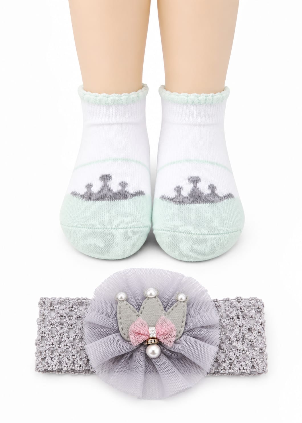 Children's socks with crowns and a matching headband on a white background