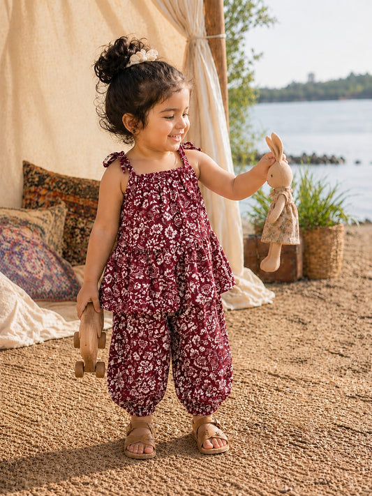 Shop the Bloom Girls Summer Set from Little Escape 2026. A lightweight printed co-ord featuring a flowy top and relaxed balloon-fit trousers, designed for breathable comfort and playful summer style.