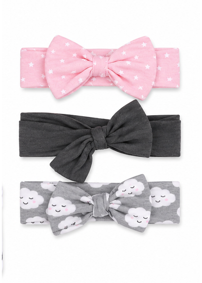Three baby headbands with bow details, displayed vertically on a white background. The top headband is light pink with white star patterns.