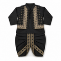 A black traditional 3-piece dhoti kurta for infants, featuring a long-sleeve collared top with gold geometric embroidery and matching black pants with gold patterned trim, displayed flat against a white background.