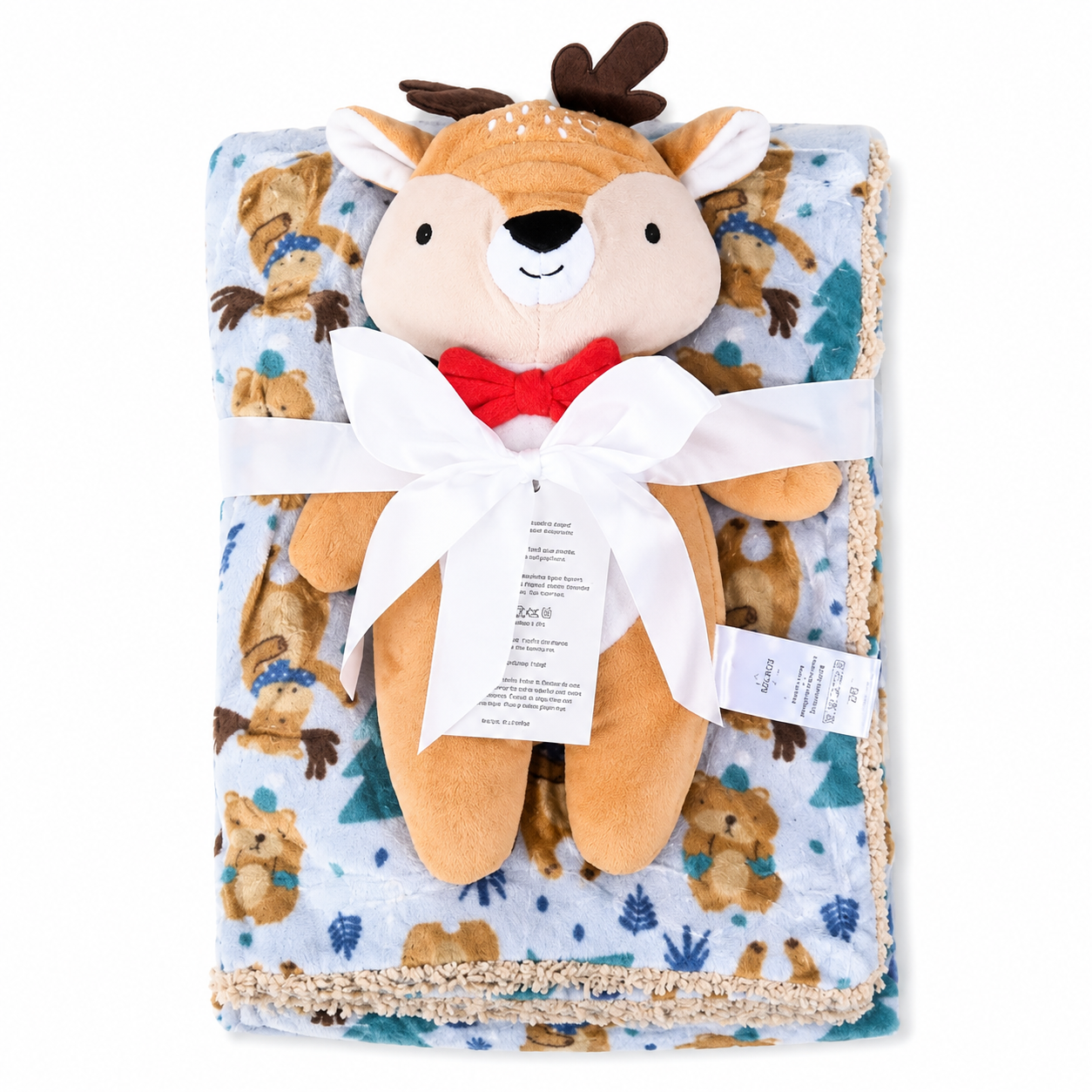 A baby gift set featuring a plush deer toy with a red bow tie and a matching fleece blanket printed with teddy bears and Christmas trees, wrapped in a white ribbon with a product tag.