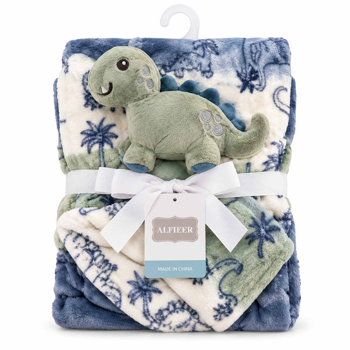 A folded plush blanket set with a matching dinosaur plush toy, wrapped in a white ribbon with a hanging tag that reads ALFIEER, on a white background.