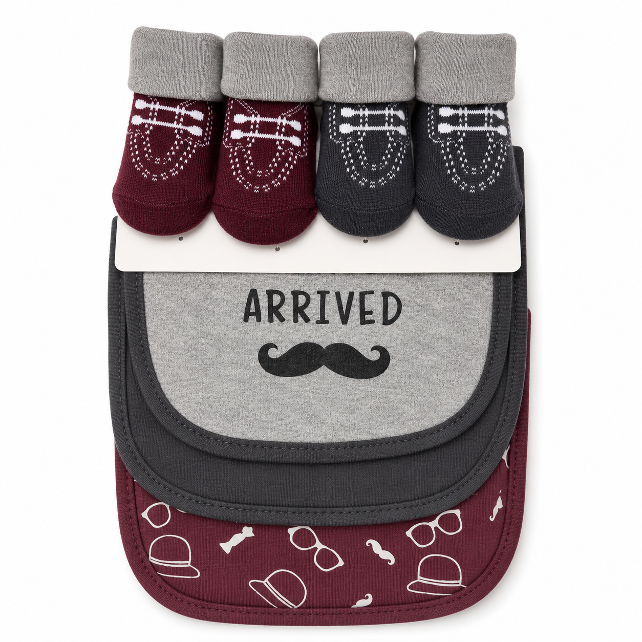 A baby accessory set featuring four pairs of socks on a white card above a matching bib. The socks come in burgundy, dark gray, and black with white mustache patterns.