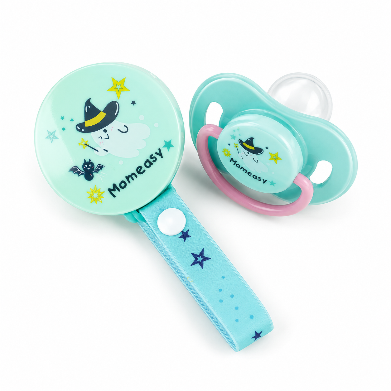 A baby pacifier and matching rattle set on a white background. The pacifier has a mint green shield with a pink ring, a clear nipple, and a witch graphic.