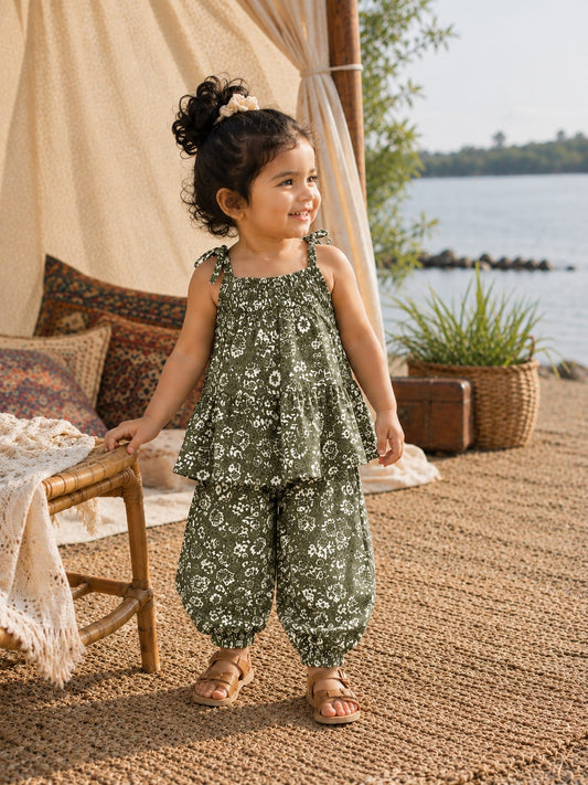 Shop the Bloom Girls Summer Set from Little Escape 2026. A lightweight printed co-ord featuring a flowy top and relaxed balloon-fit trousers, designed for breathable comfort and playful summer style.
