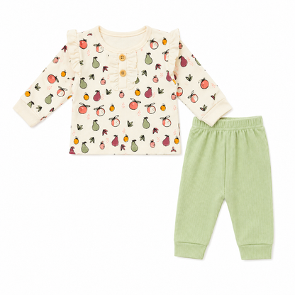 Baby's outfit with patterned long-sleeve shirt and green pants on a white background
