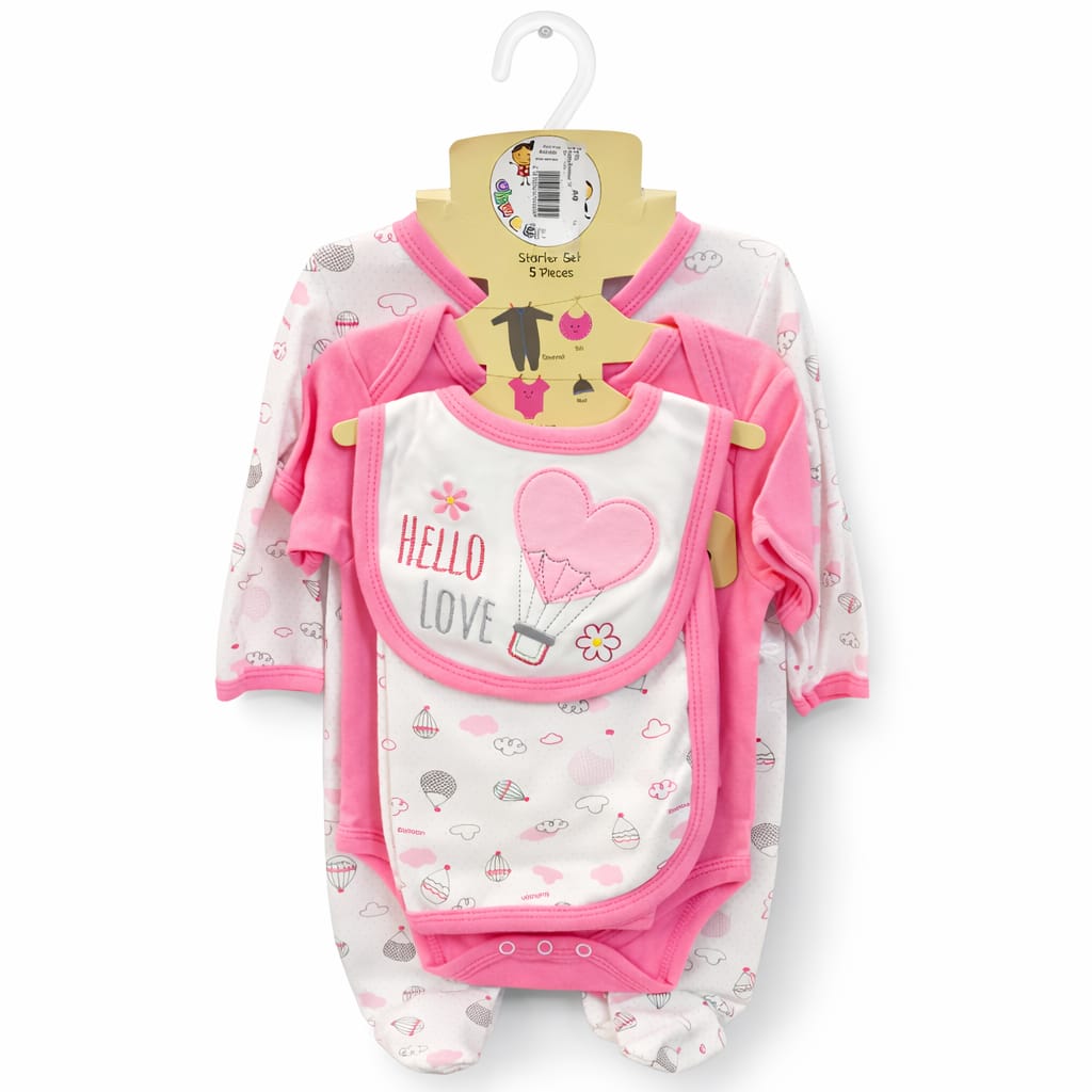 Baby clothing set with onesie, bib, and pants on a hanger against a white background