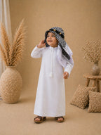 Boy wearing a premium black thobe with white shemagh