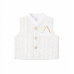 A white sleeveless vest with a subtle vertical textured pattern, featuring three gold buttons, a pointed collar, and a small white pocket square with a gold triangular accent on the chest.
