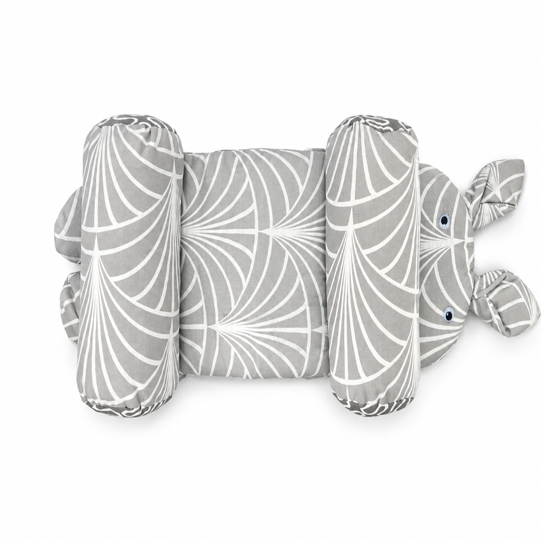 A plush baby support pillow shaped like a rabbit, featuring a gray and white geometric fan pattern, photographed on a solid white background.