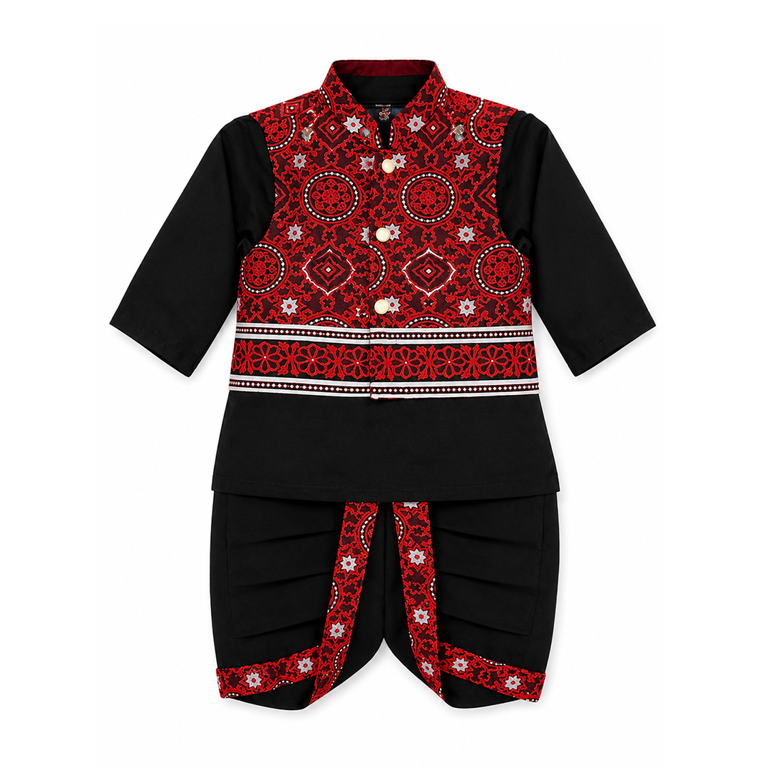 A traditional outfit for boys, featuring a black dhoti with ajrak patterned borders, paired with a matching red ajrak waistcoat and a black kurta with full sleeves.