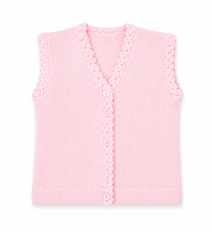 A light pink sleeveless knit vest with a V-neck, decorative scalloped trim, and a button closure, shown flat against a white background.