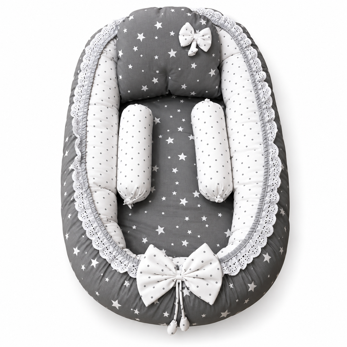 Grey star print baby snuggle bed with white polka dot neck rolls, pillow and lace trim by BabyCo Pakistan