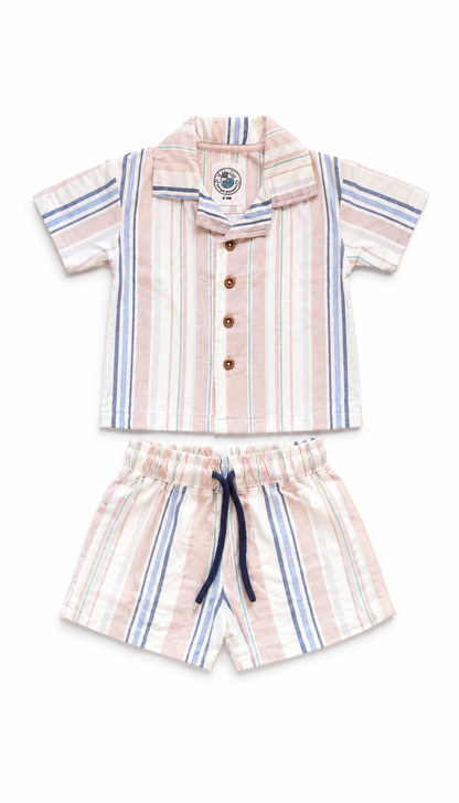 A two-piece baby boy's casual set featuring a short-sleeve button-up shirt and matching shorts, both with vertical stripes in pink, beige, and blue with a navy drawstring.