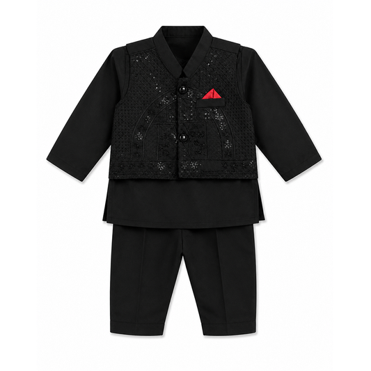 A black traditional outfit set for a child, featuring a long-sleeve collared jacket with textured embroidery and a small red pocket square, paired with matching black trousers, shown on a plain white background.
