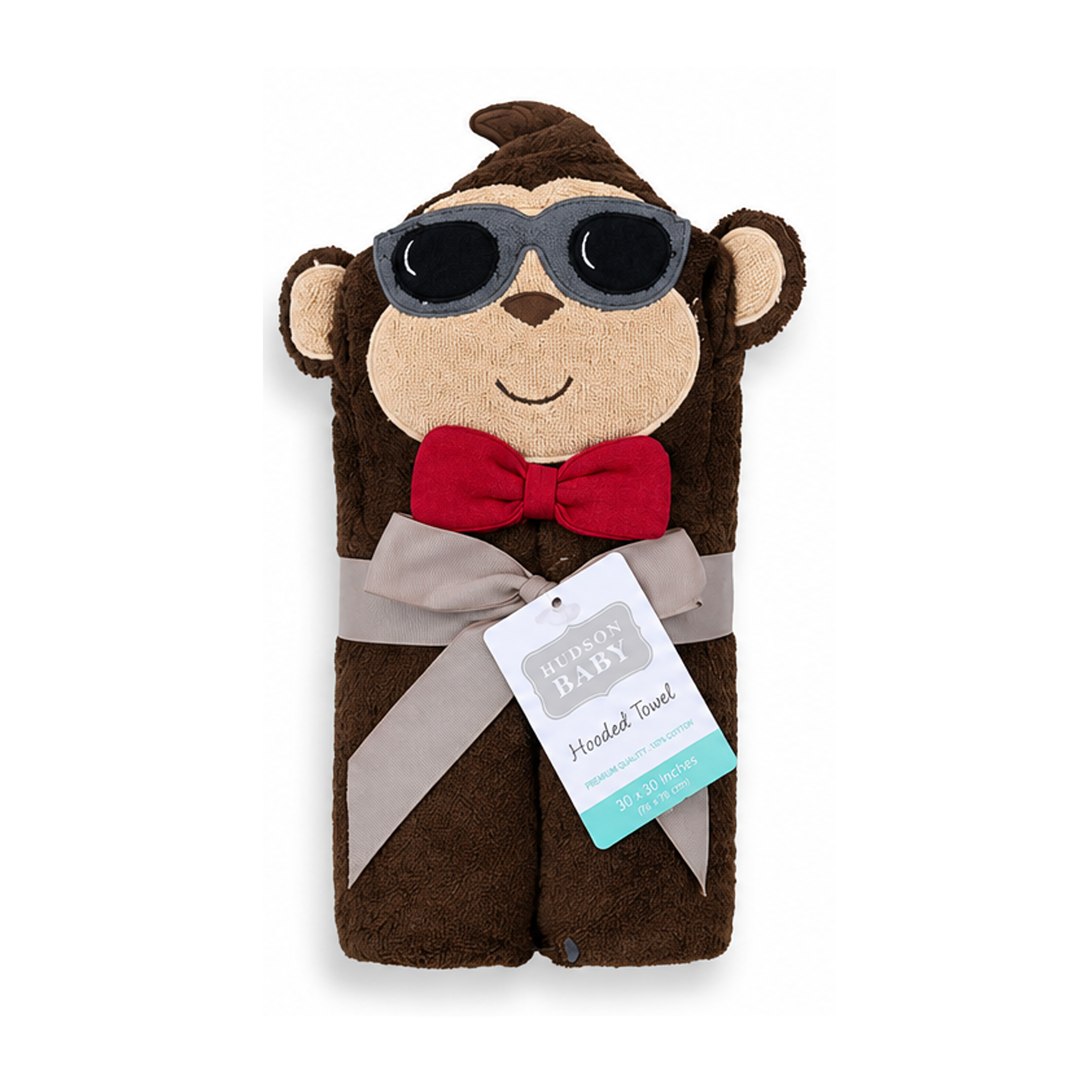 Plush monkey toy with sunglasses and a bow tie, wearing a hooded towel, on a white background.