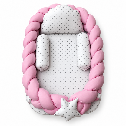 Pink braided baby snuggle bed with white polka dot pillow and two neck rolls by BabyCo Pakistan