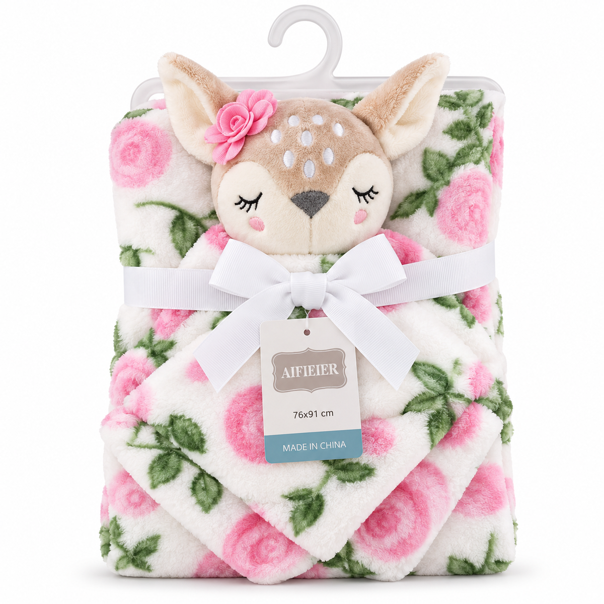 A folded plush baby blanket with a pink rose floral pattern, featuring a cute plush deer head with closed eyes and a pink flower in its ear, packaged with a white ribbon bow and hanger on a white background.