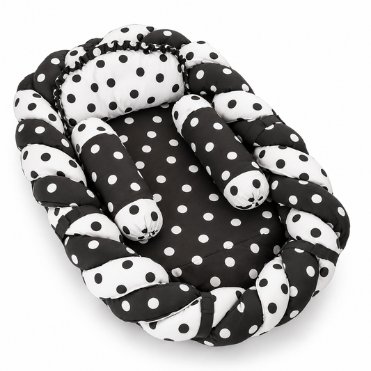Black and white polka dot baby snuggle bed with two neck rolls and matching pillow by BabyCo Pakistan