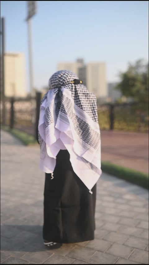 360° view of premium black Habibi baby thobe with white shemagh by BabyCo