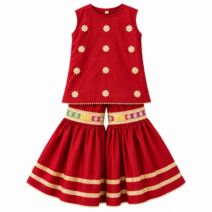 BabyCo red cotton dhanak sleeveless kurti and flared sharara set with ivory floral embellishments and multicolour embroidered waist bands