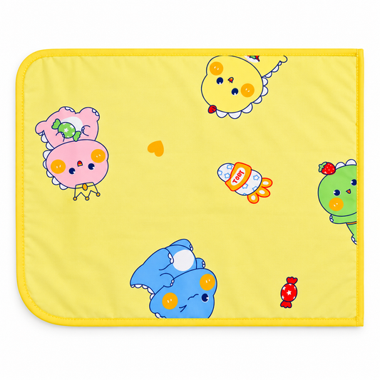 Yellow baby diaper changing mat with playful pastel cartoon characters